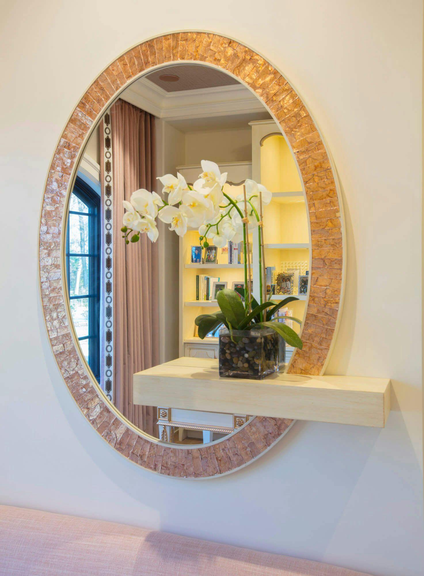 large oval mirror with accent trim
