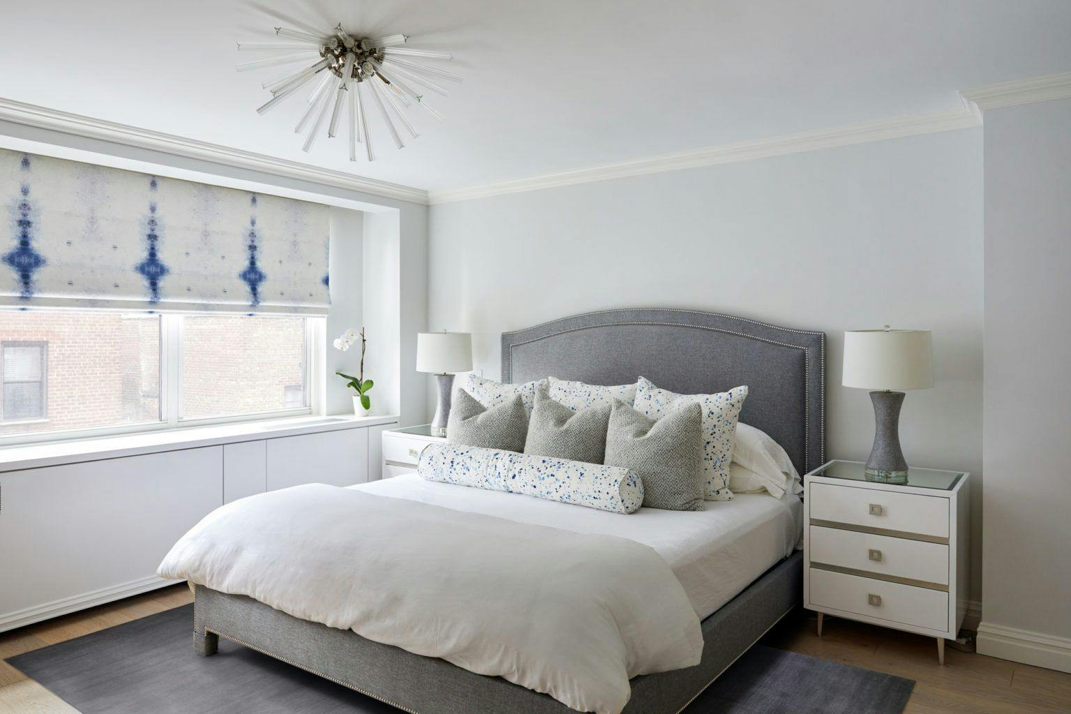 70th street bedroom with gray tones and blue acccents